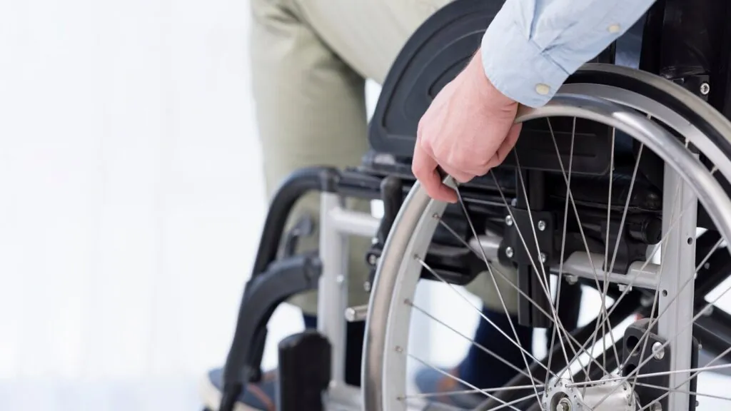 hand-wheelchair-wheel-close-up_23-2148476601