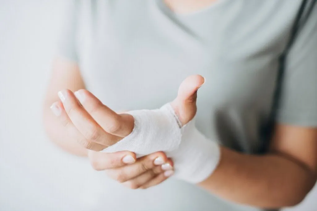 woman-with-gauze-bandage-wrapped-around-her-hand_53876-63276